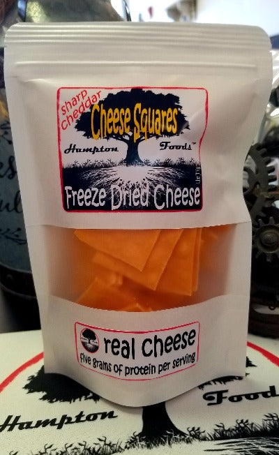 Hampton Foods' Sharp Cheddar Cheese Squares! Are you ready to elevate your snacking game to a whole new level? Look no further than Hampton Foods' brand-new creation – Sharp Cheddar Cheese Squares! Packed with flavor and that satisfying snap, this freeze-dried delight is about to become your new snack-time obsession.