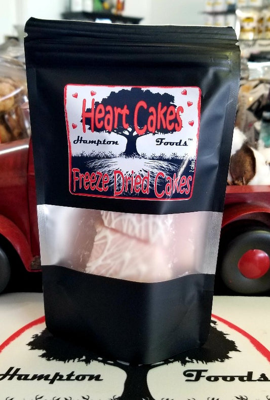 Hampton Foods' Latest Sensation: Heart Cakes! We've taken your favorite snack cake to a whole new level by freeze-drying it. Imagine heart-shaped white cakes with a luscious creme filling, coated with a dreamy pink icing, and crowned with a tempting drizzle of white frosting. 
