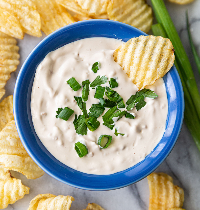Looking for a delicious and easy-to-make dip that's perfect for any occasion? Look no further than Hooser Daughters™ Green Onion Dip Mix! Our specially-crafted blend of powdery herbs and spices, including parsley and onion pieces, is designed to provide a burst of flavor that will have your taste buds singing with delight. And with a creamy texture that's simply irresistible, it's the perfect complement to any snack or appetizer.