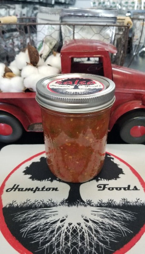 Enjoy the delicious, authentic taste of Hampton Foods' Family Recipe Salsa, available in a 16oz jar. Perfect for chips, tacos, and parties. Order now!