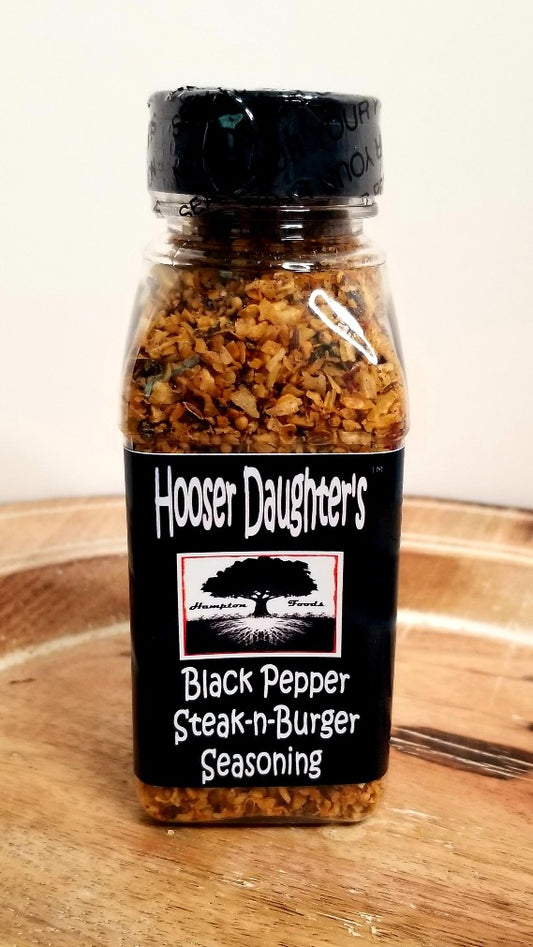 Experience a symphony of flavors with Hooser Daughters™ Black Pepper Steak-n-Burger Seasoning. Elevate your culinary creations to new heights with this versatile blend of hand-selected black peppercorns and premium spices. Perfect for grilling gourmet steaks, crafting mouthwatering burgers, or adding a zesty kick to roasted veggies. Unleash bold flavors in every bite – order now and savor the magic of our expertly crafted seasoning!