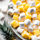 Indulge in a Symphony of Flavor with Hampton Foods' Pineapple Fluff! Freeze Dried Magic! Introducing the perfect marriage of vanilla marshmallows with a burst of pineapple goodness! We've taken the classic allure of vanilla marshmallows and infused them with the tropical essence of pineapple. 
