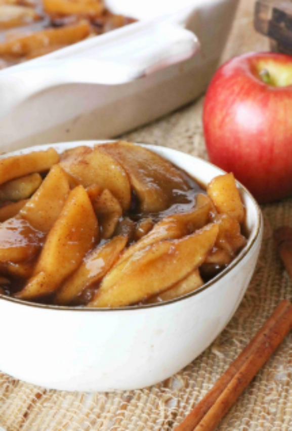 Red Delicious Apple beside a dish of cinnamon apples.