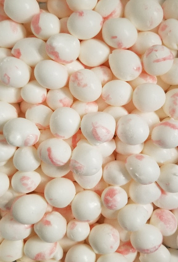 Peppermint Bombs has just the right amount of flavor without overpowering your taste buds. The classic white with a red striped design is hard to beat, containing egg whites and milk for a creamy, melt-in-your-mouth taste and texture that is without comparison. This gourmet freeze dried Peppermint taffy tastes better than Christmas morning! Grab a bag of this customer favorite today! Each triple sealed, resealable bag contains 26 +/- wonderful pieces of Peppermint Bombs.