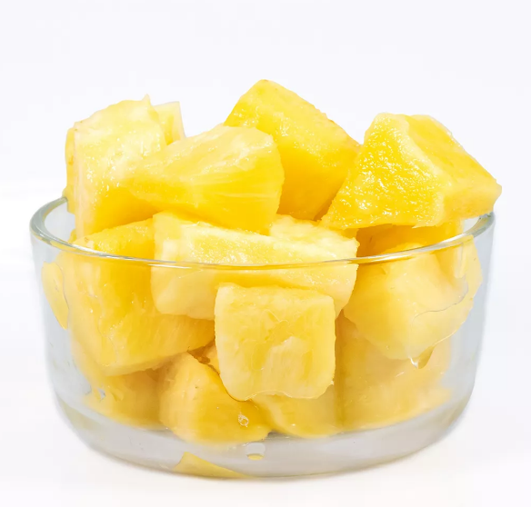 glass bowl of fresh pineapple chunks